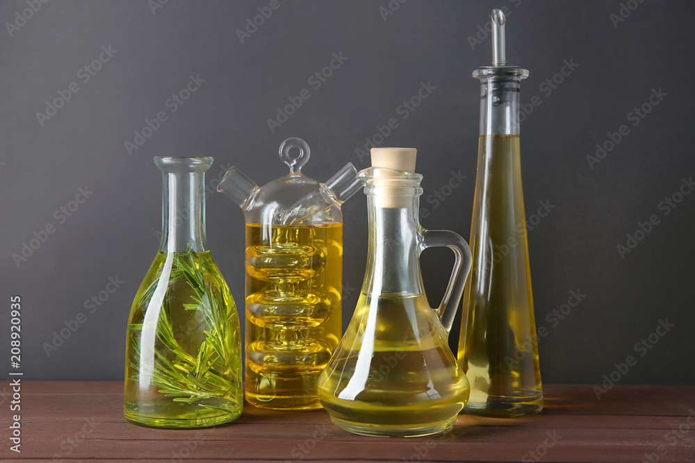 Glassware with olive oil on wooden table