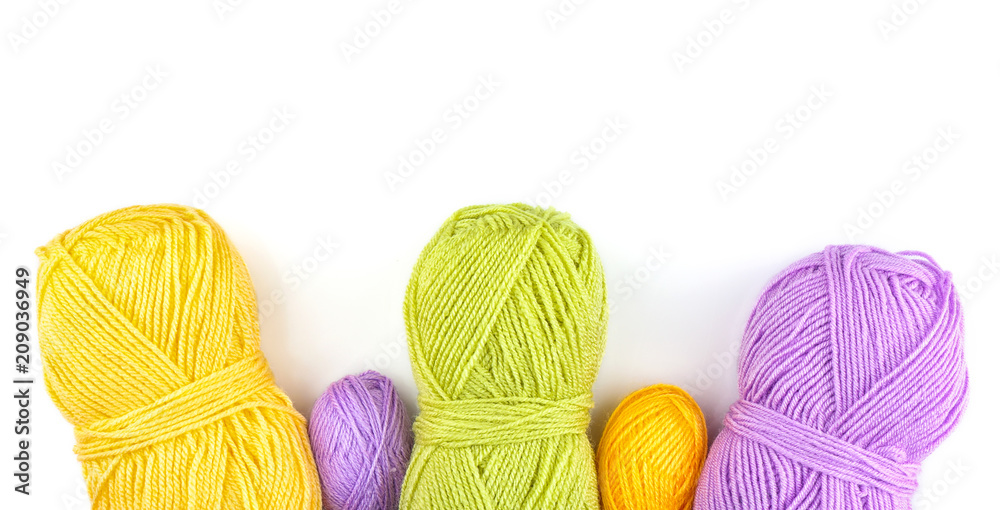 Colorful knitting yarn on white background