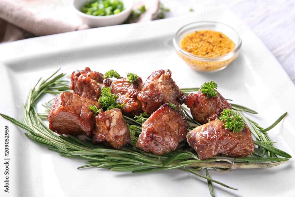 Barbecue skewers with juicy meat and herbs on plate