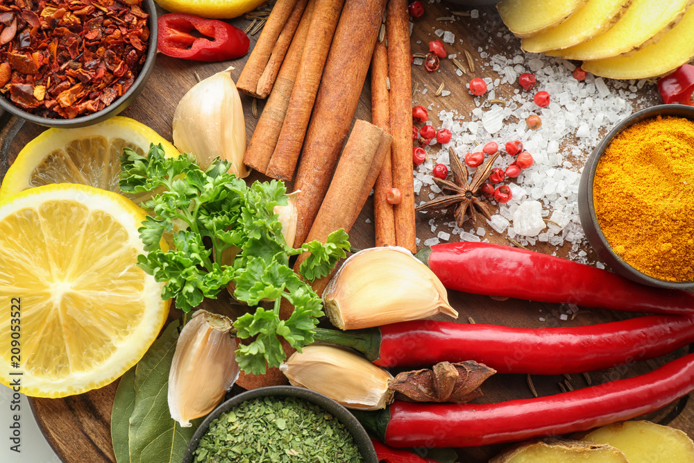 Various spices on wooden board