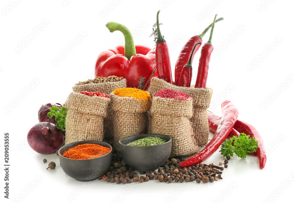 Sacking bags and bowls with various spices on white background