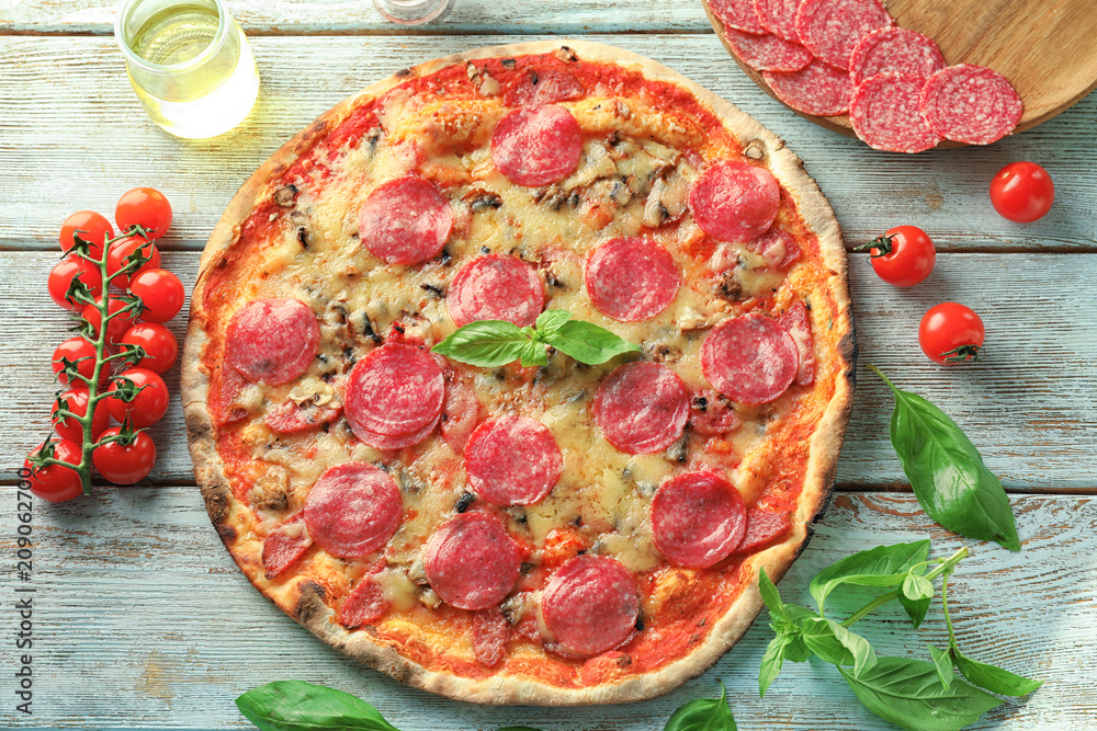 Tasty Italian pizza on wooden table