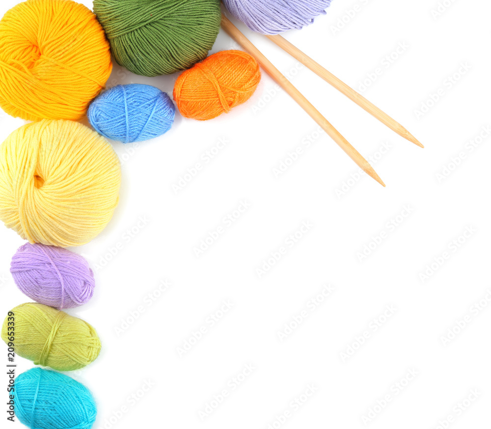 Knitting yarn with needles on white background