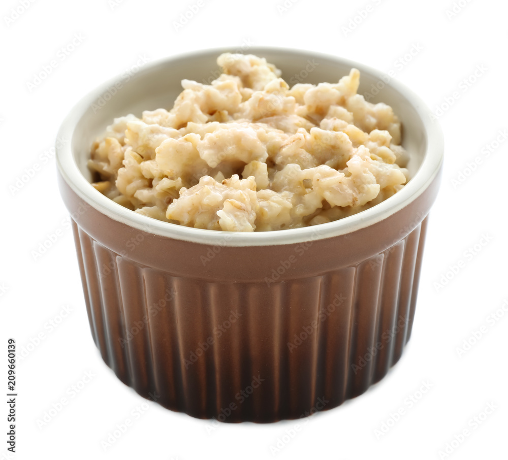 Bowl with prepared oatmeal on white background