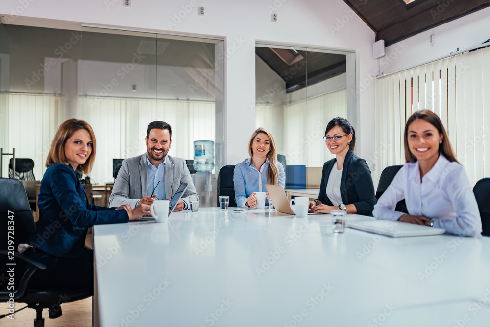 Business people in conference room.