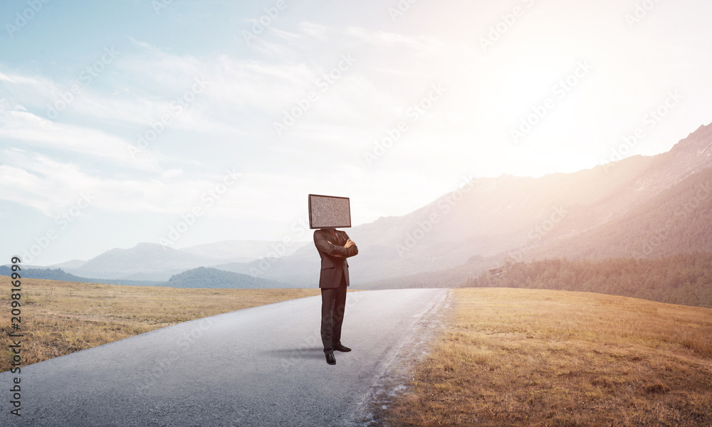 Businessman with TV instead of head.