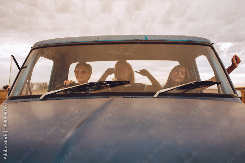 female friends having fun on road trip