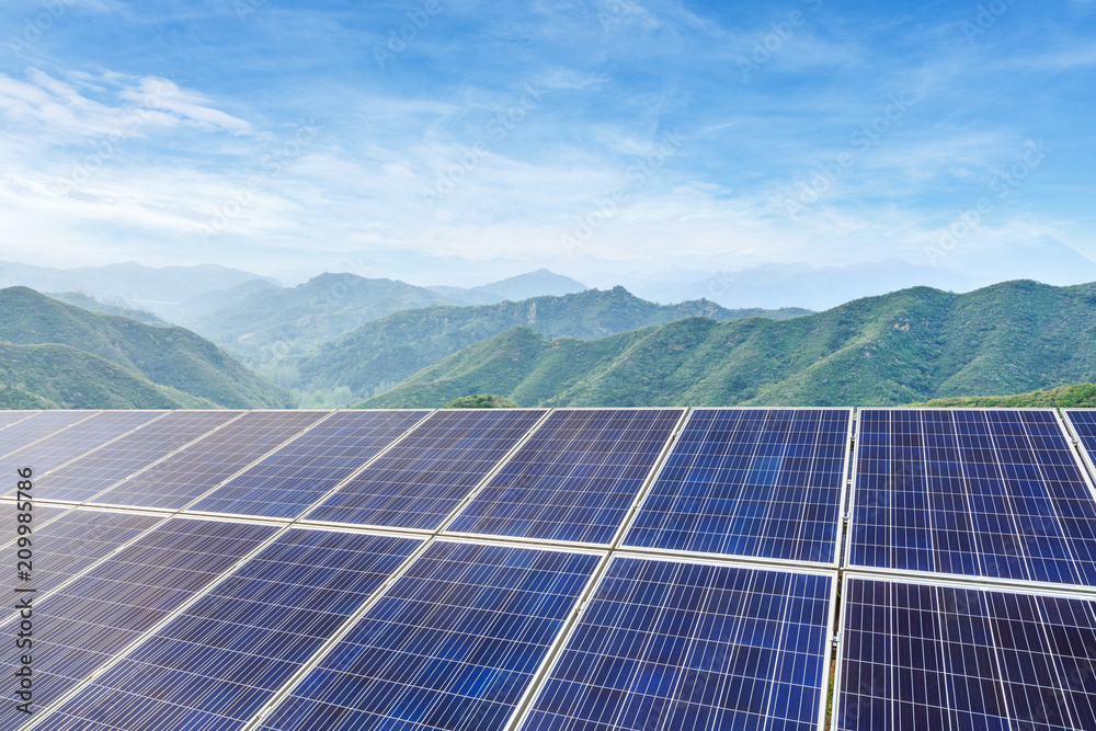 Solar panels and mountains landscape