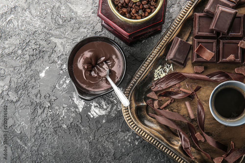 Composition with delicious chocolate and cup of coffee on table