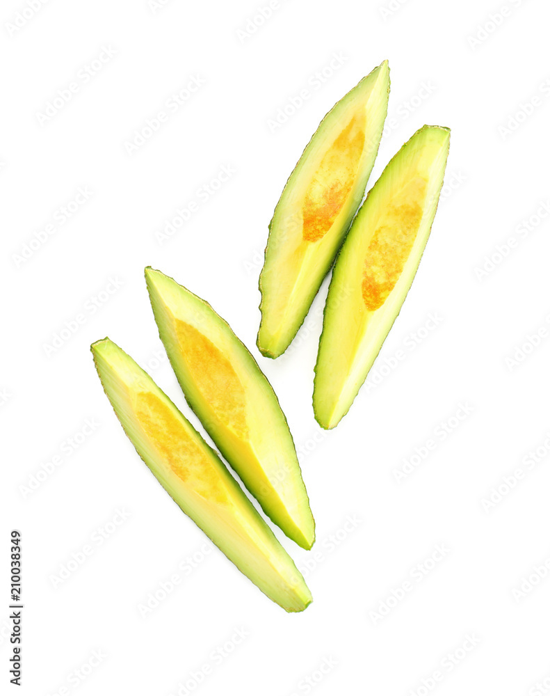 Pieces of ripe avocado on white background