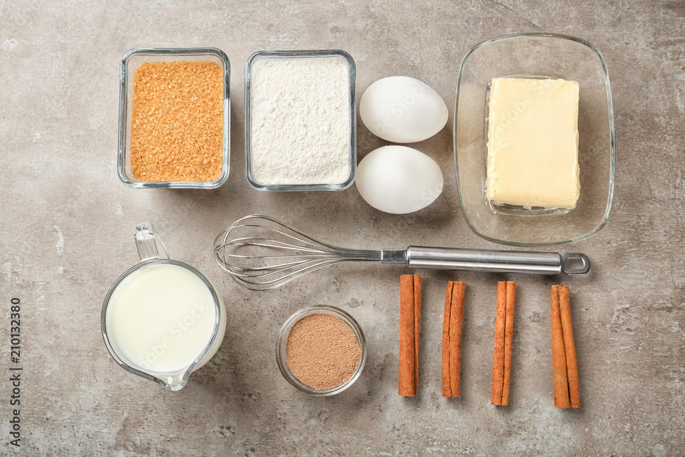 Ingredients for cooking cinnamon buns on table, top view