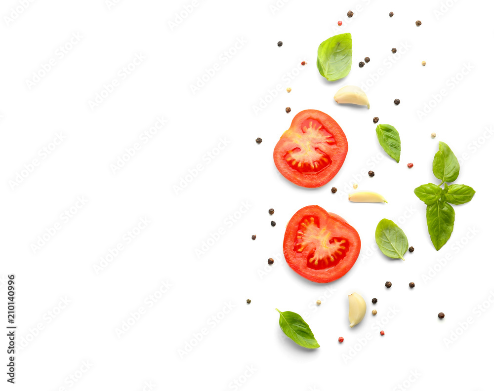 Fresh green basil with tomatoes and spices on white background