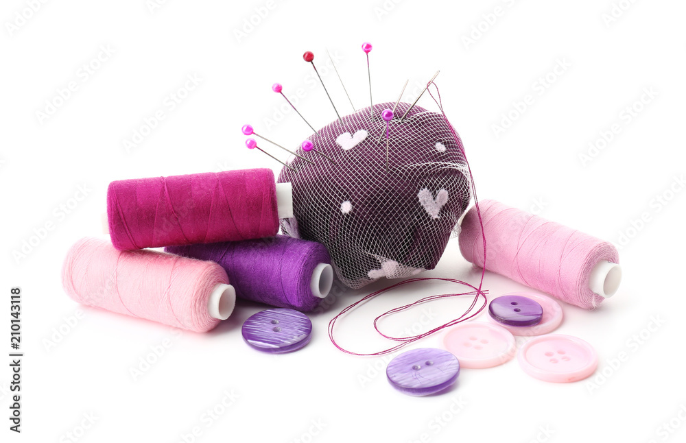 Sewing accessories on white background