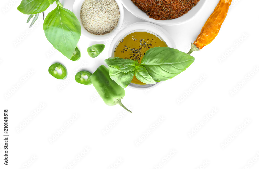 Different kinds of spices with herbs on white background