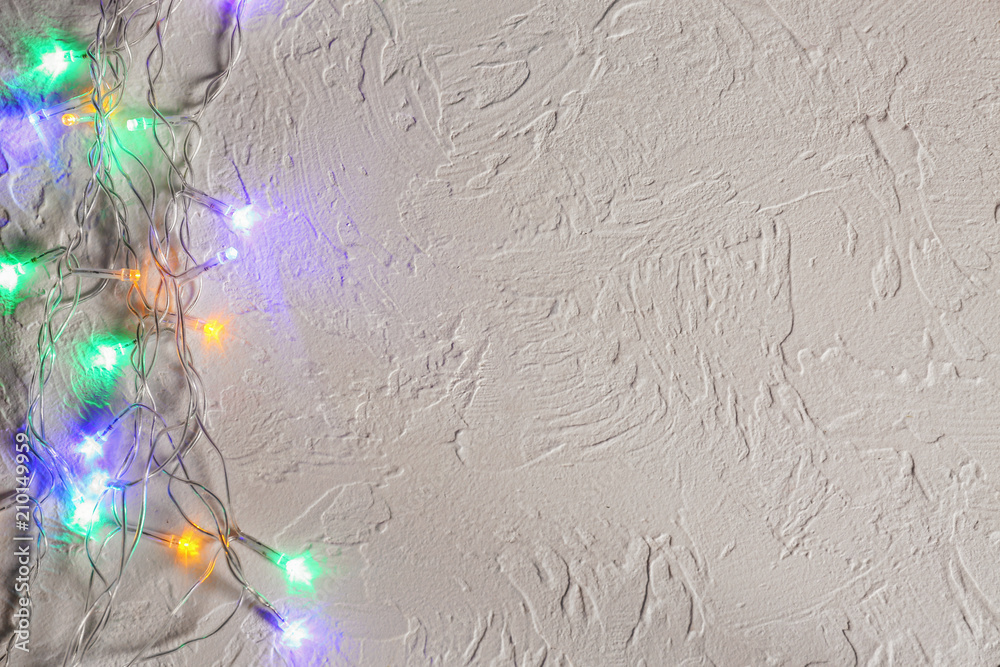 Christmas garland on textured background