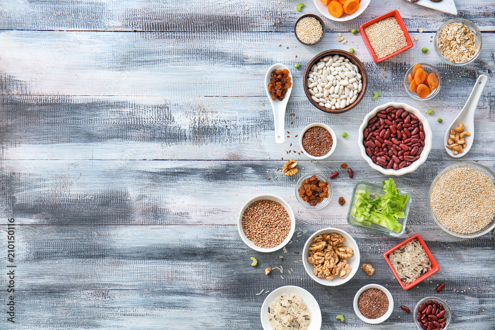 Composition with various healthy products on wooden background