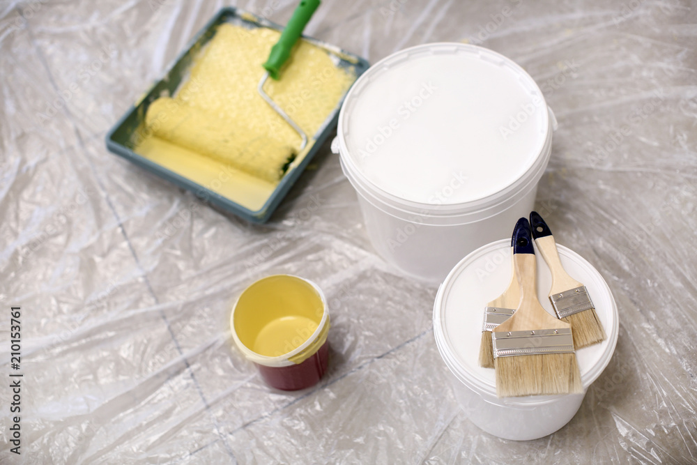 Buckets with paint and brushes indoors indoors