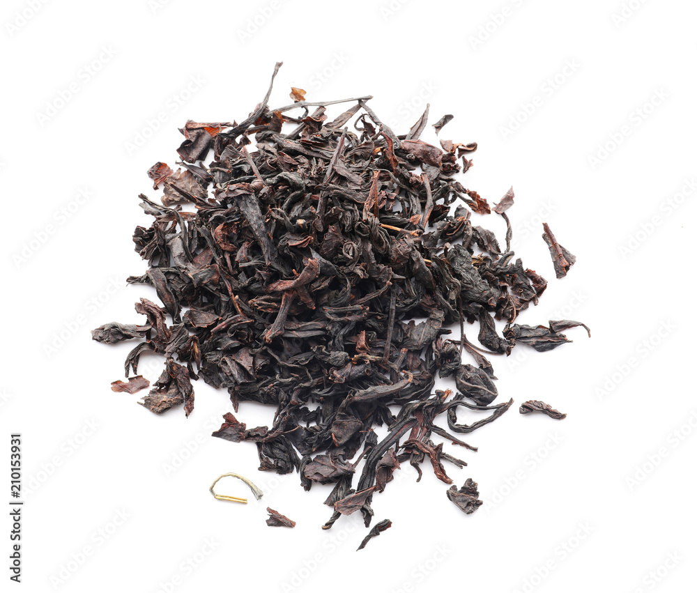 Heap of dry black tea on white background