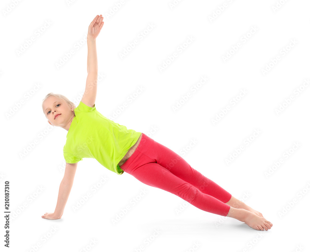 Little girl practicing yoga on white background