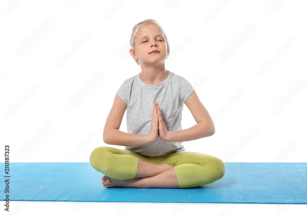 Little girl practicing yoga on white background