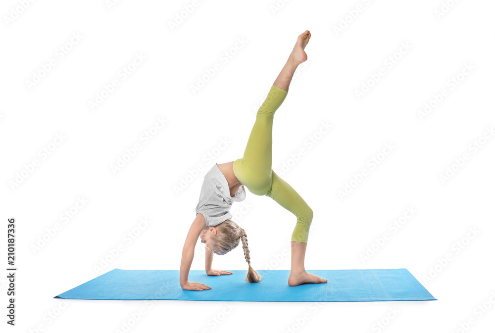 Little girl practicing yoga on white background