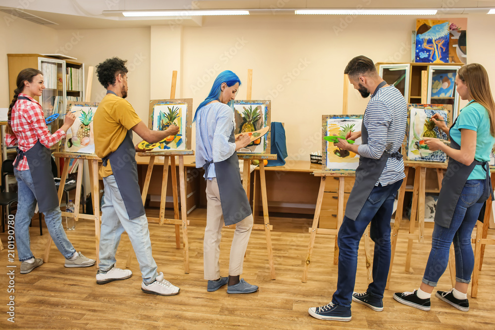 Art students painting in workshop