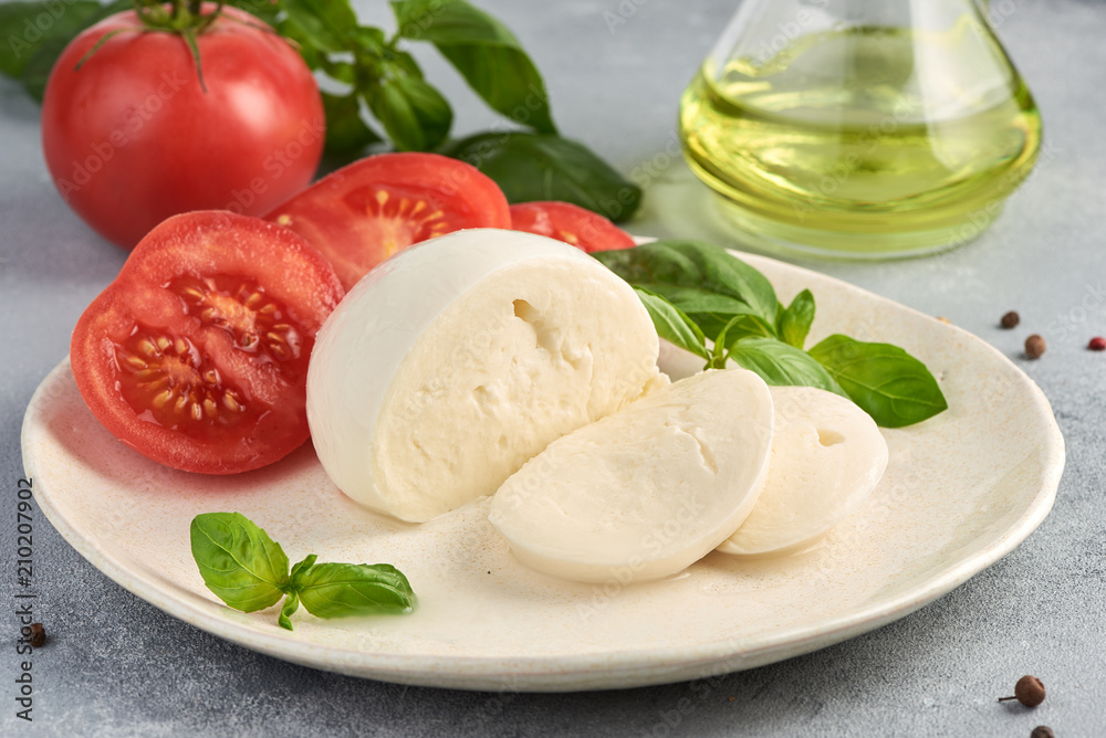 Mozzarella Buffalo with basil leaves and tomatoes.