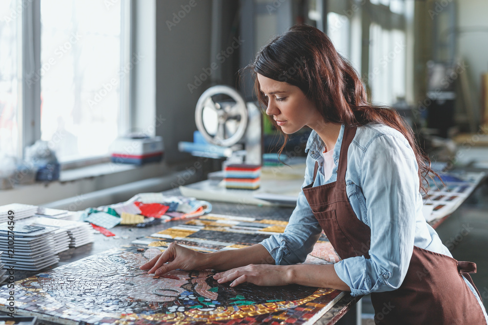 Young woman in uniform with mosaic