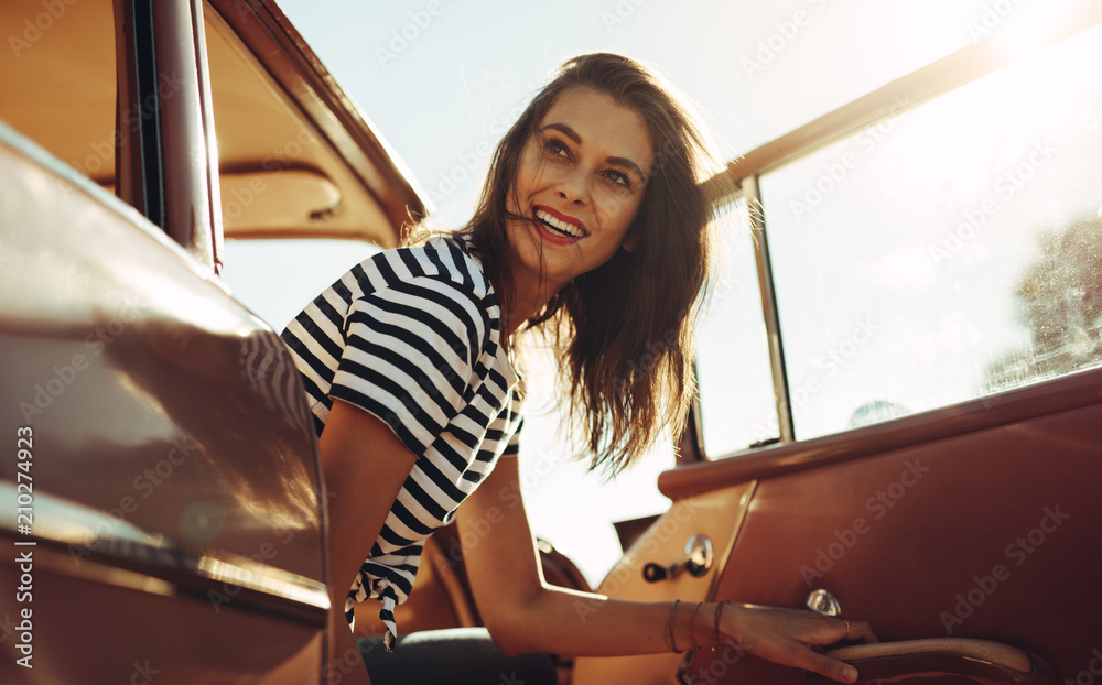 Woman having a break on road trip