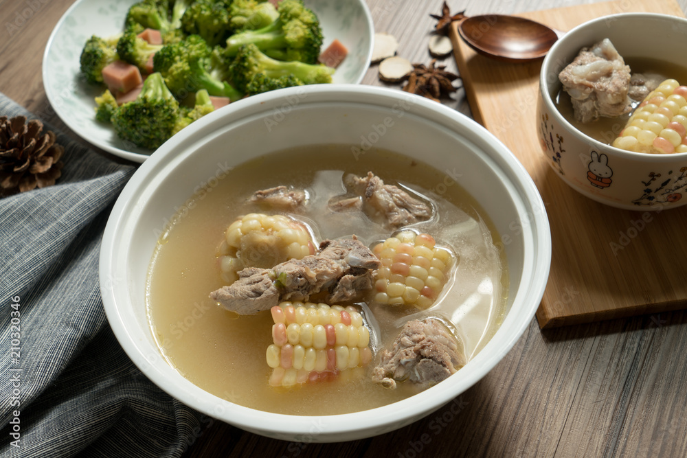 Bone soup with wood grain background