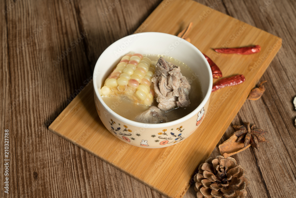 Bone soup with wood grain background