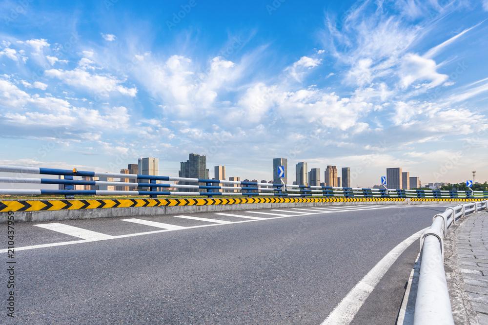 empty asphalt road with modern office building in urban