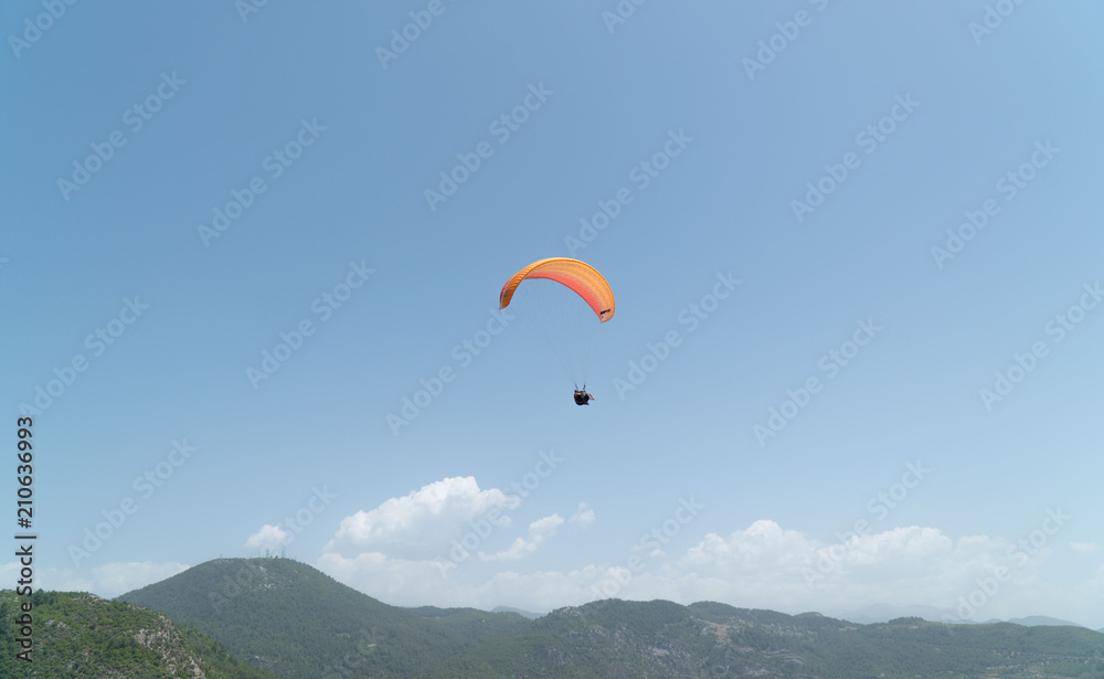 Tourists are engaged in paragliding