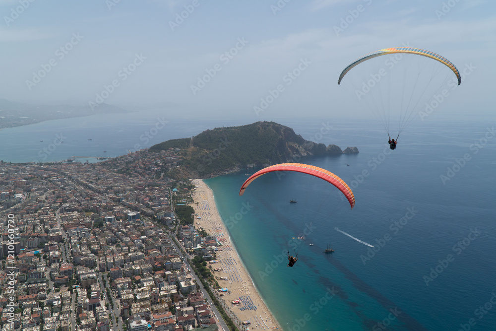 Two tourists fly on paragliding on vacation in Turkey