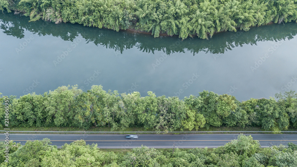 Aerial top view road track with car and river, around the tree and forest, Aerial view of the road t