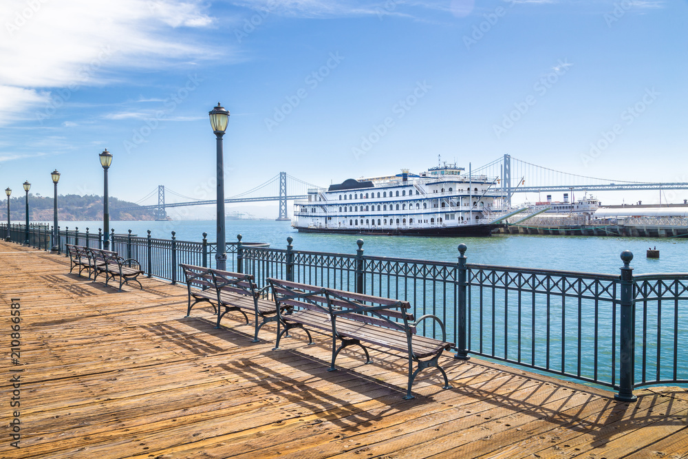 Historic Pier 7 with paddleboat and Bay Bridge, San Francisco, USA