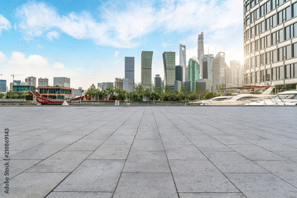 Urban skyscrapers with empty square floor tiles