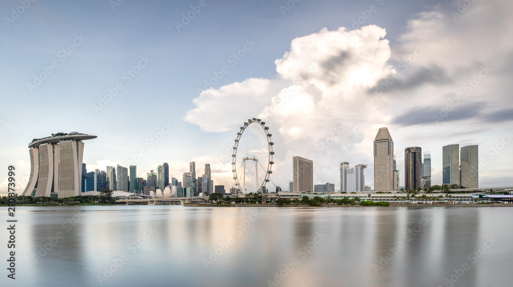 Sun rising over the downtown skyline of Singapore as viewed from across the water from The Garden Ea