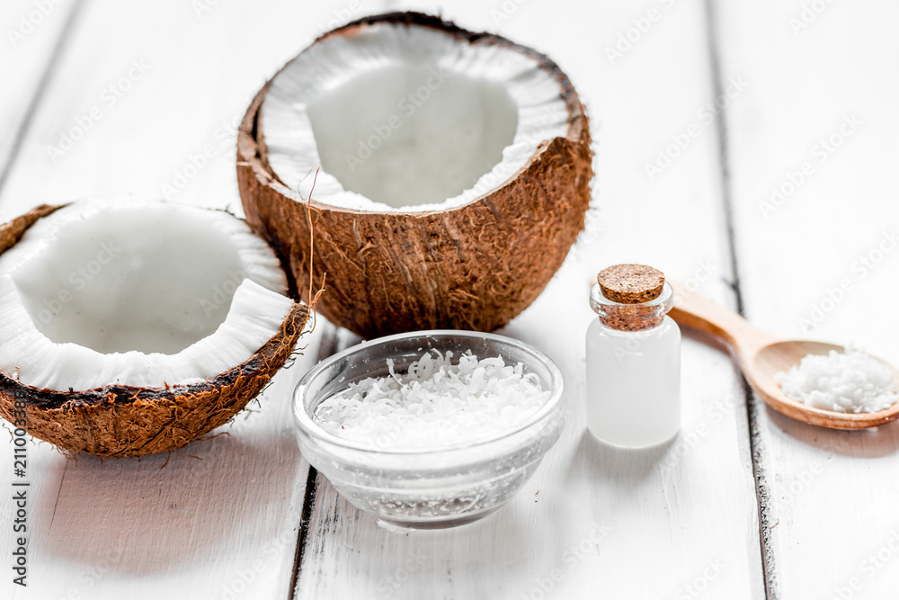 coconut oil for body care in cosmetic concept on white desk