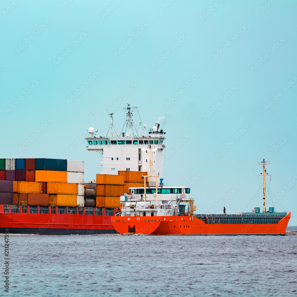 Red container ship underway