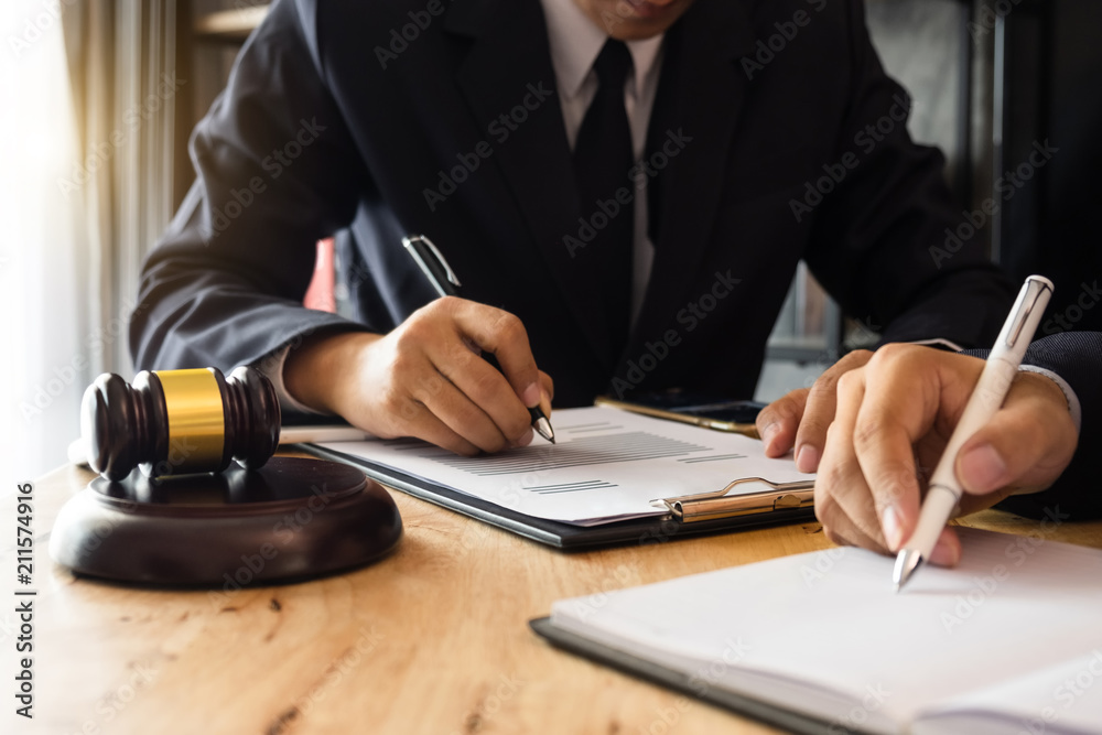 business people and lawyers discussing contract papers sitting at the table. Concepts of law, advice