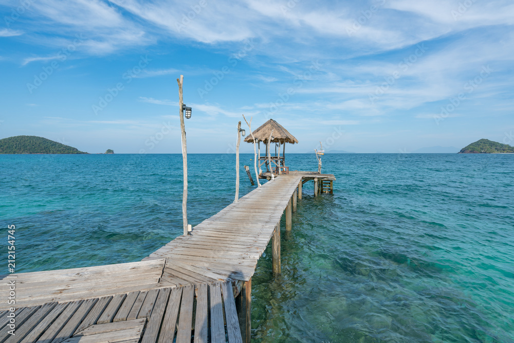 Wooden pier with boat in Phuket, Thailand. Summer, Travel, Vacation and Holiday concept.