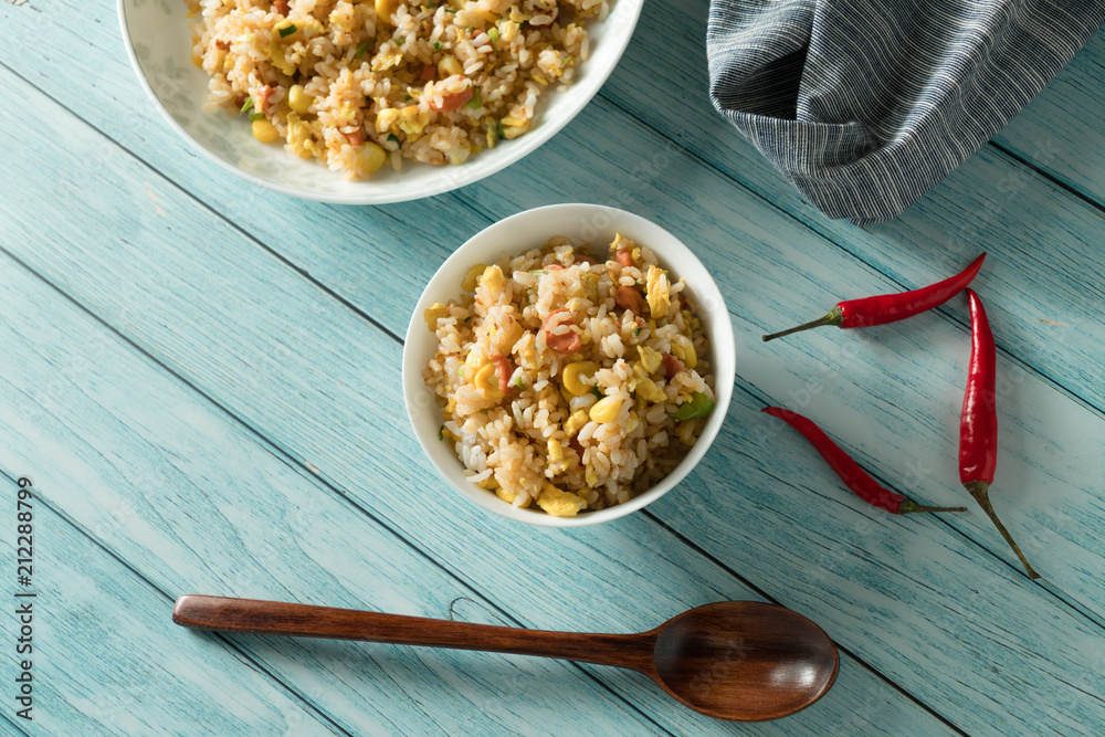 Egg Fried rice with a blue wood grain background