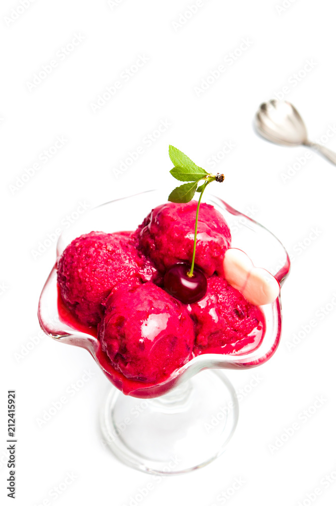 Cherry ice cream scoops in a cup