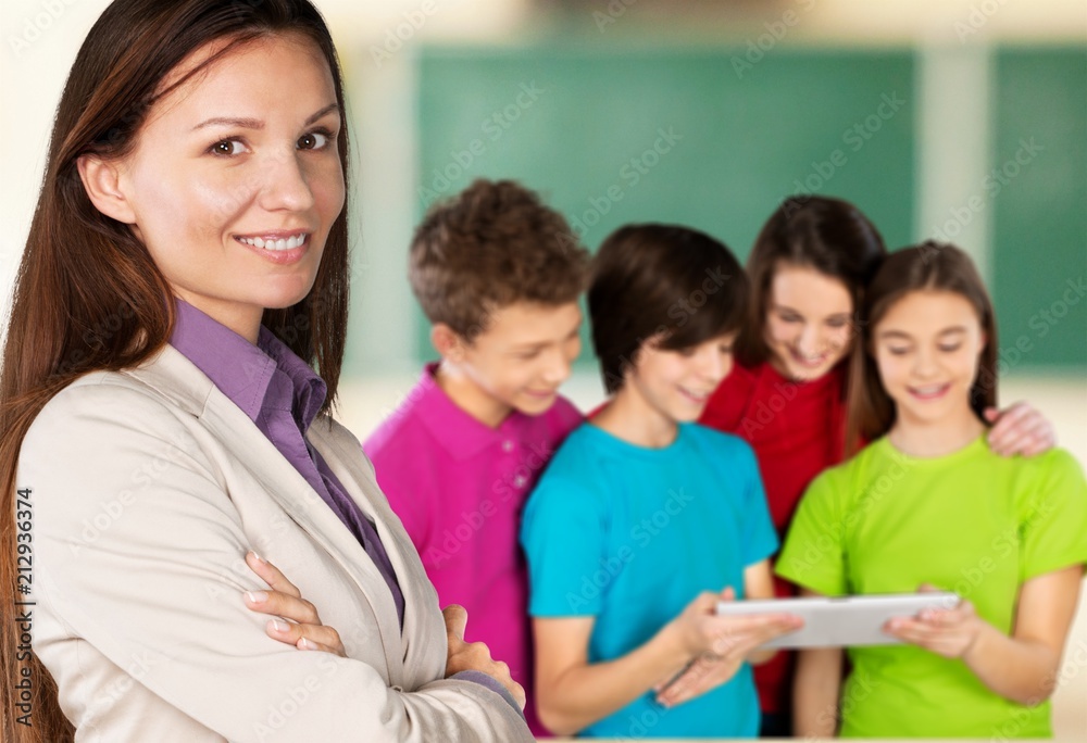 Female teacher with children at class