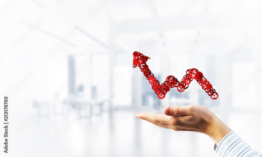 Progressing graph presented in male palms as symbol of success and improvement