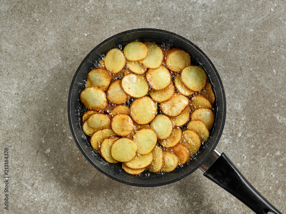 frying potatoes in a pan