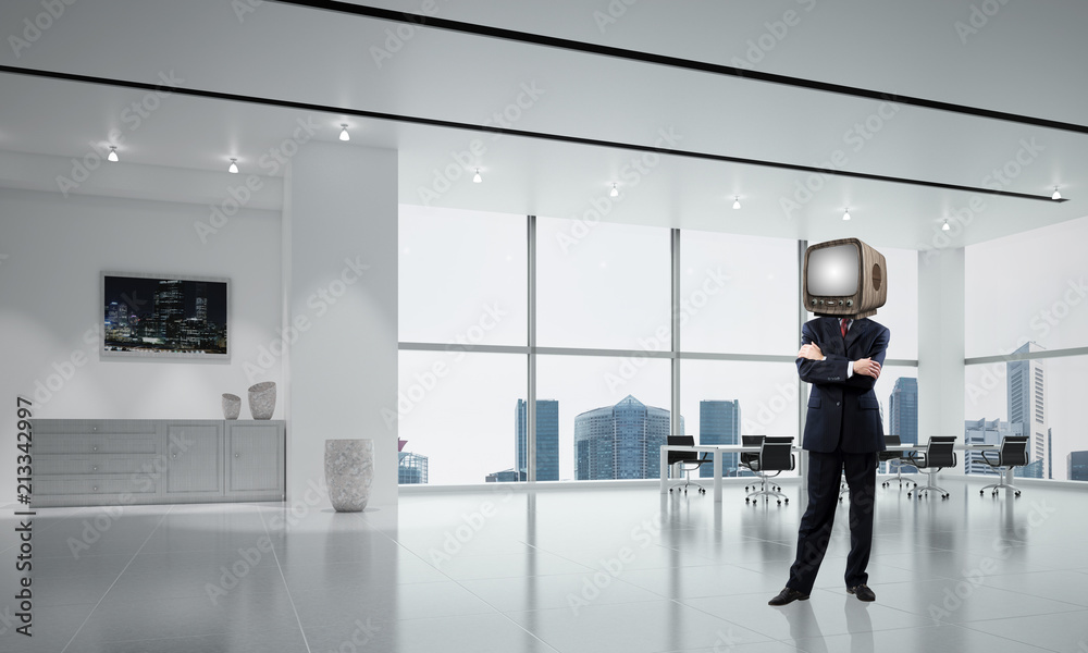 Businessman with an old TV instead of head.