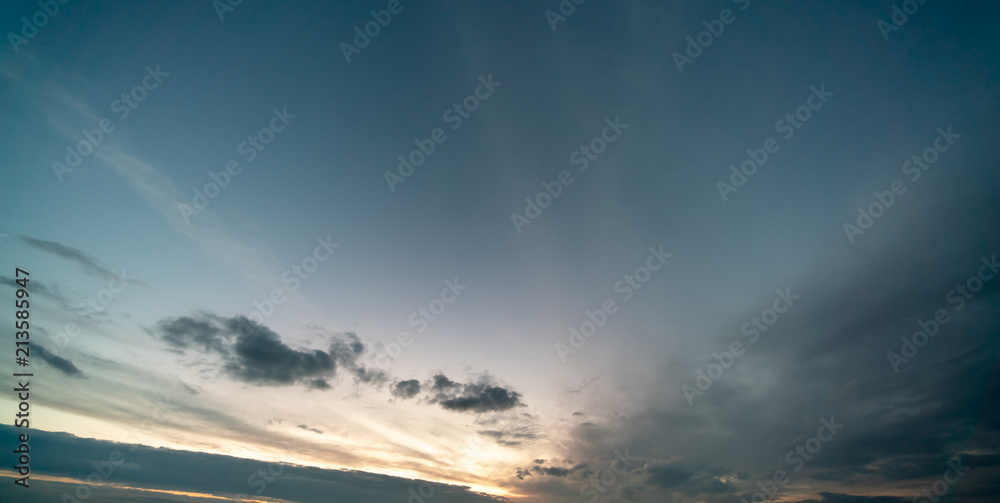 Sunset / sunrise with clouds, light rays