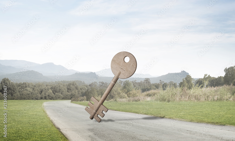 Conceptual background image of concrete key sign on asphalt road